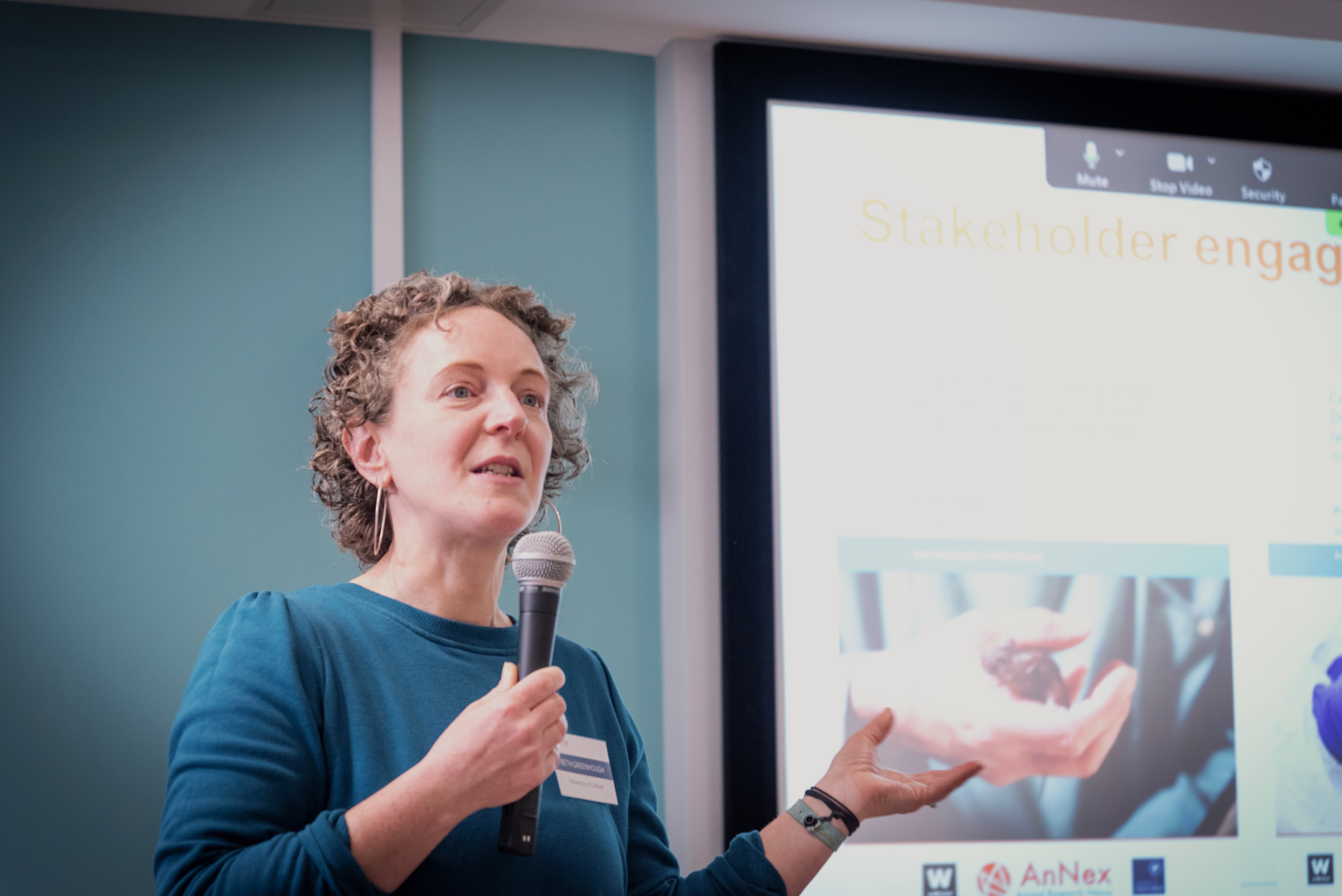 Beth Greenhough talking at the conference in front of a screen that reads stakeholder engagement